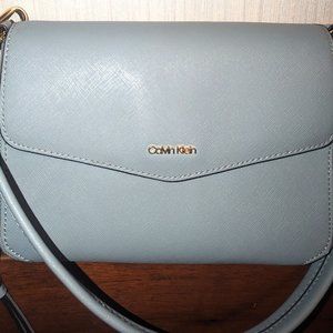 Calvin Klein envelope style shoulder bag with magnetic closure.